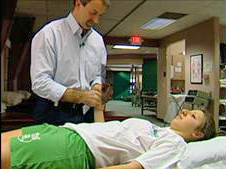 Thom Krupar uses PRRT to relieve pain on a patient